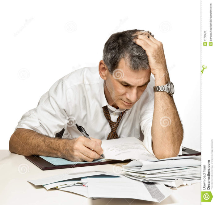 man-paying-bills-worrying-11783020